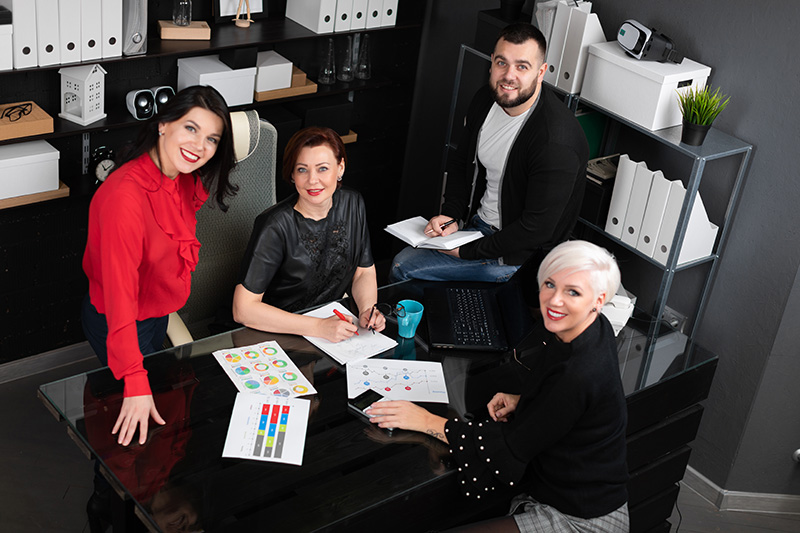 Portrait Of Smiling Employees In Workplace