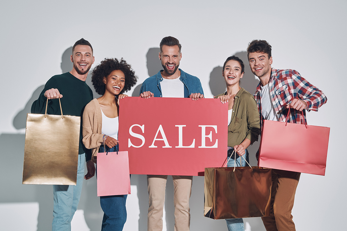 Group Of Young Beautiful People In Casual Clothing Carrying Shop